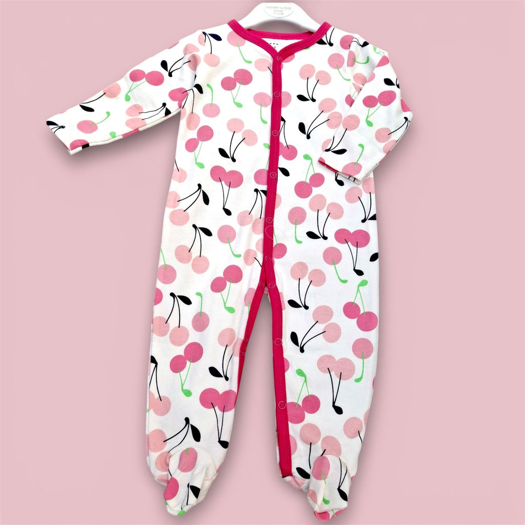 Cherry Bliss baby romper Pakistan- white romper with pink cherry print and red trim.