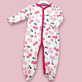 Cherry Bliss baby romper Pakistan- white romper with pink cherry print and red trim.