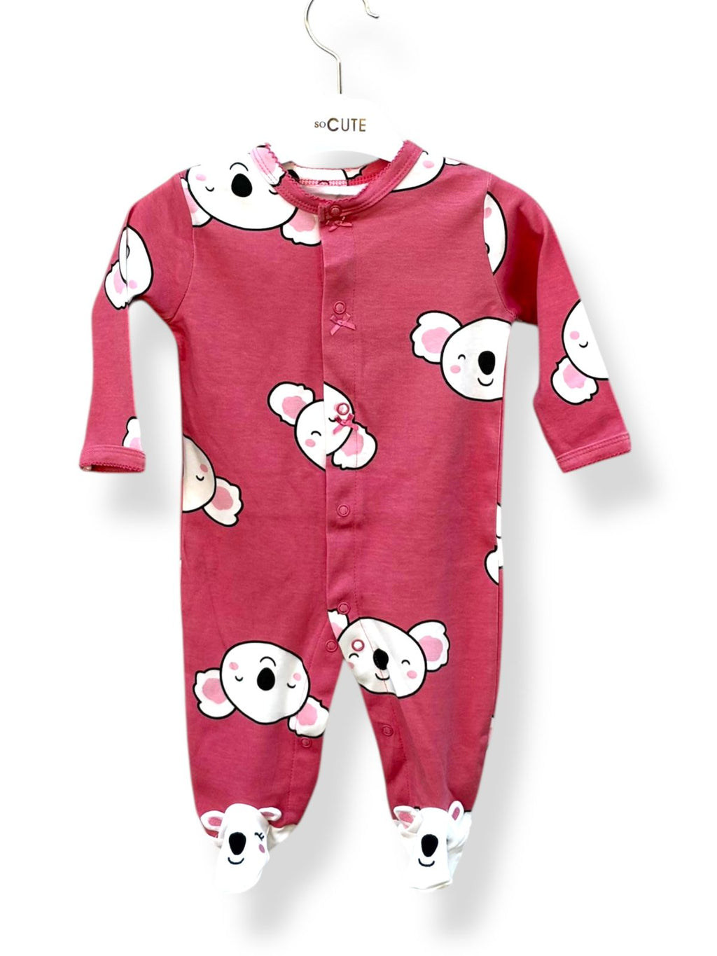 Pink baby onesie with cartoon character print on a white background