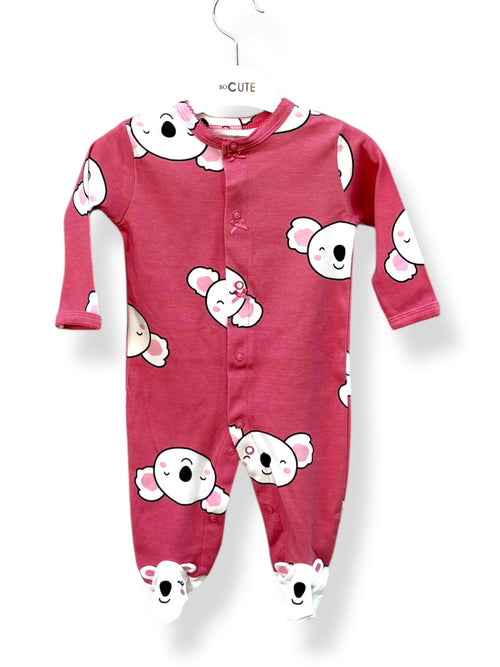 Pink baby onesie with cartoon character print on a white background