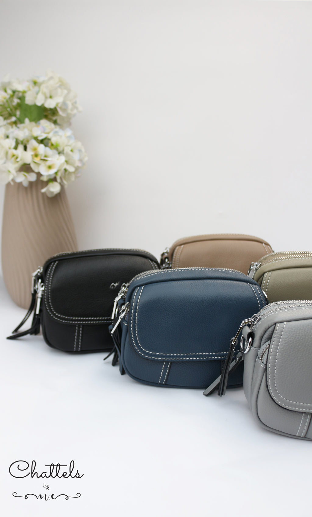 “Keva Mini Leather Crossbody bag” (Grey)